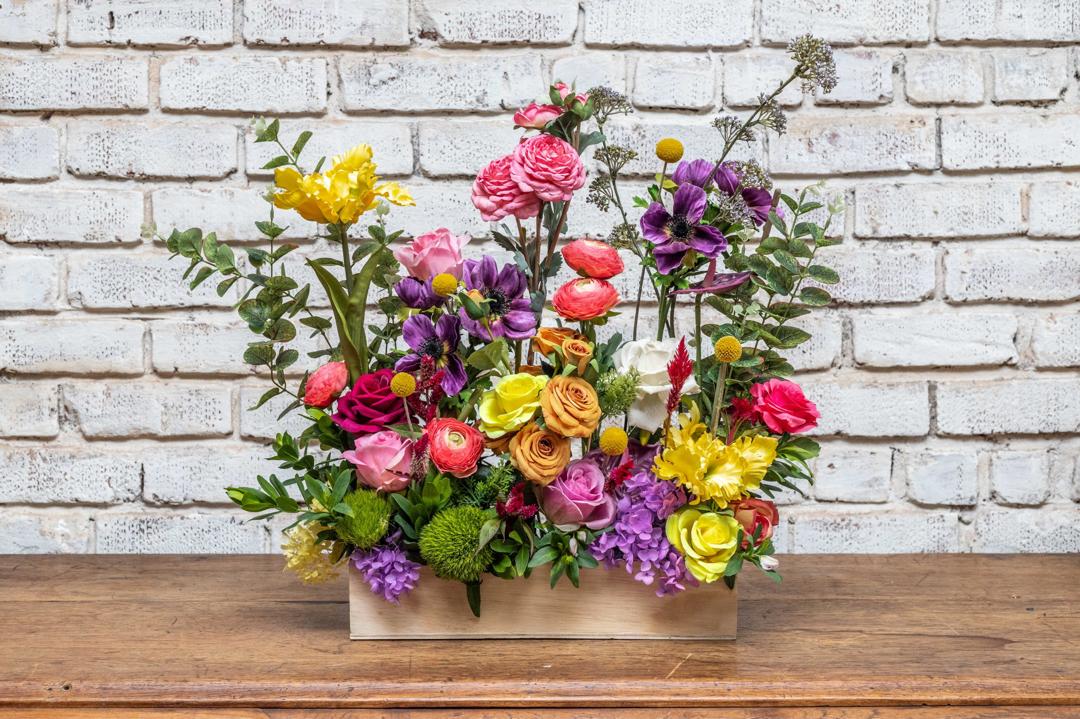 Colourful artificial spring flower box