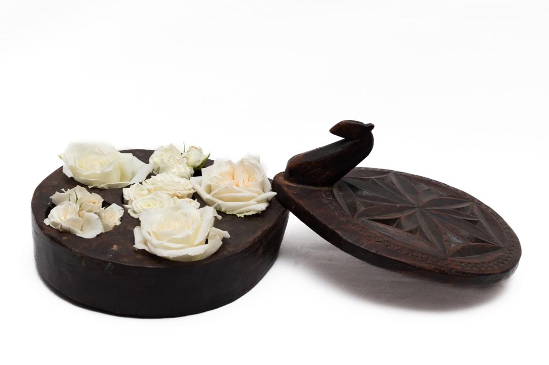 Round lidded sculptural floral vessel